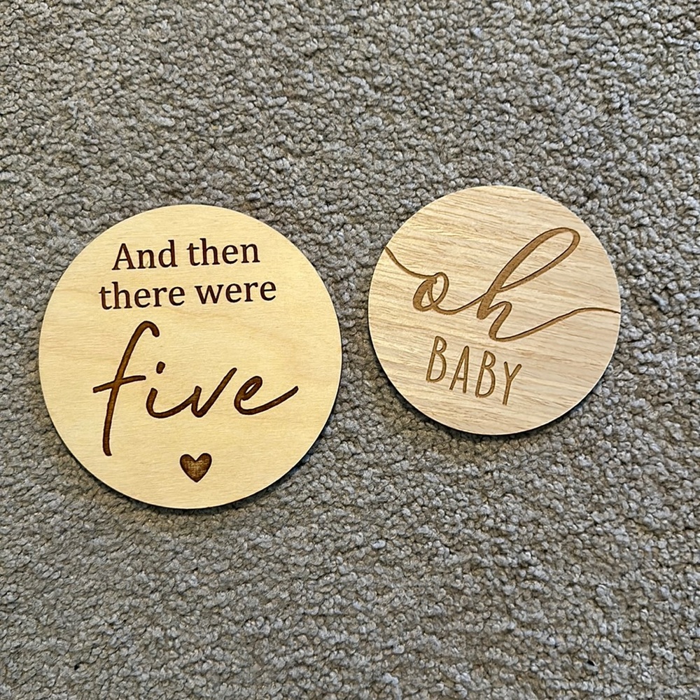 “And then there were five” and “oh baby” wood signs